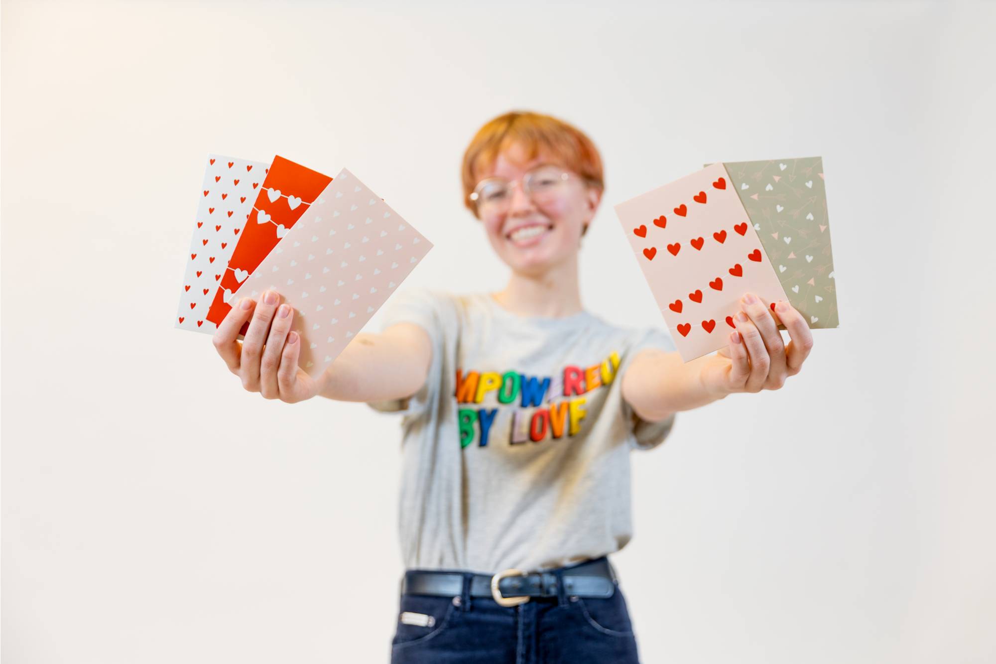 Student holding stickers at Valentine's day photoshoot